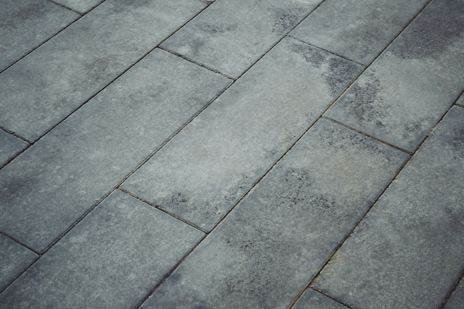 A finished bluestone paver surface laid in a clean running-bond pattern